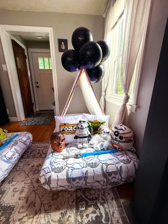 Camp Far, Far Away sleepover setup: A tent by the door with a stormtrooper standing guard.