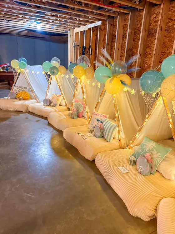 Coastal Camp sleepover setup: Soft blues, sunny yellows and cozy coastal details.