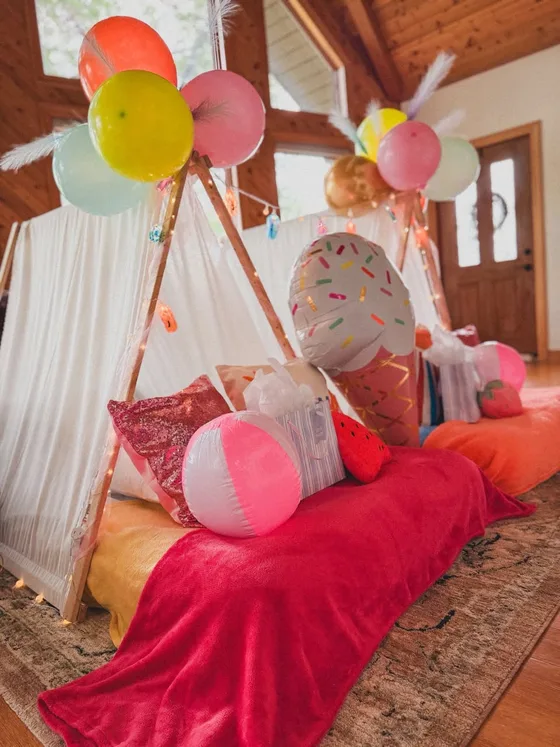 Endless Summer sleepover setup: Beach balls, sweet treats and sunny colors.