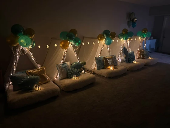 Seaside Dreams sleepover setup: Twinkle lights and a starfish garland after dark.